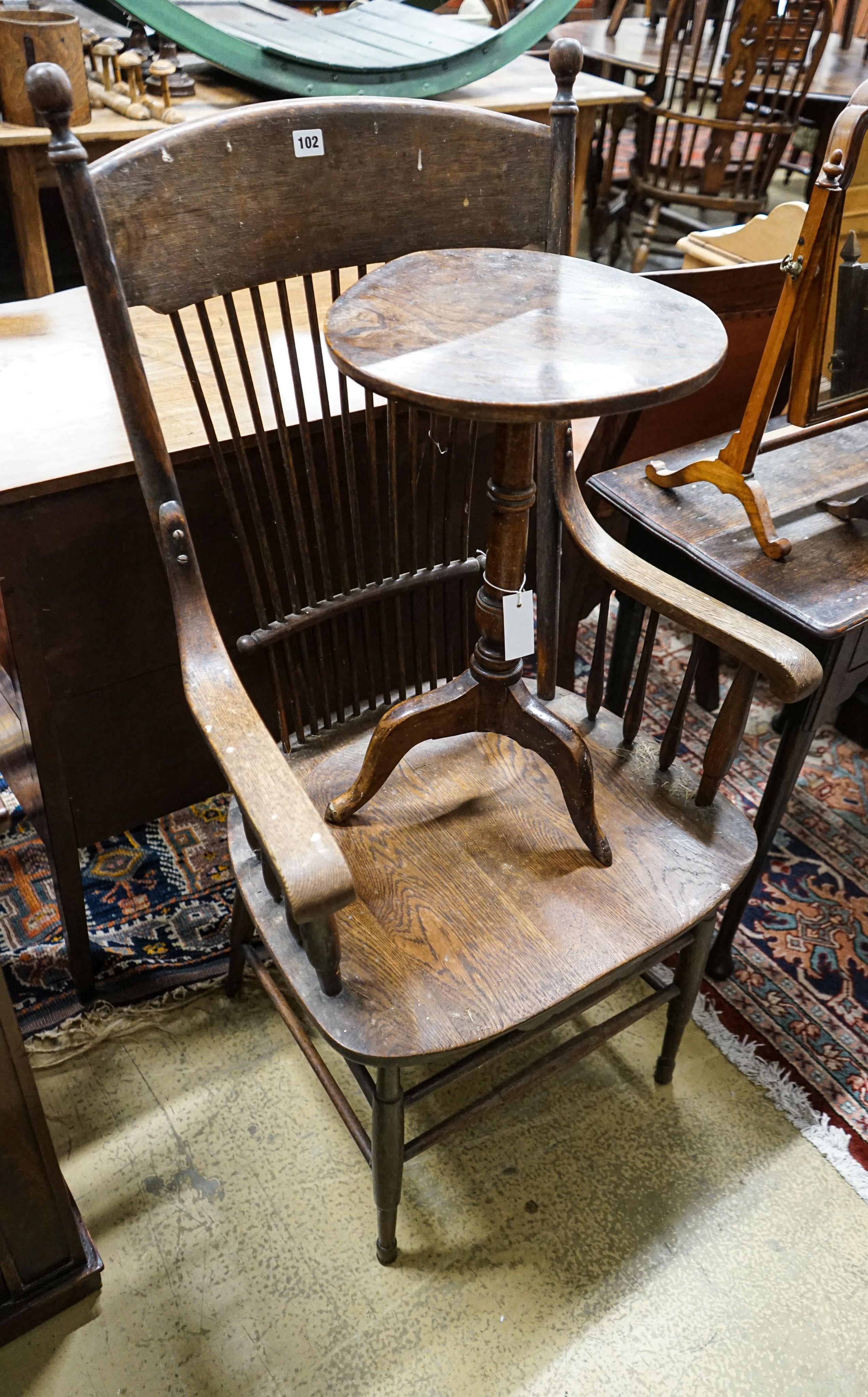 A mid 18th century elm tripod table, diameter 35cm (a.f.), height 57cm, a late Victorian oak stick back chair and two toilet mirrors